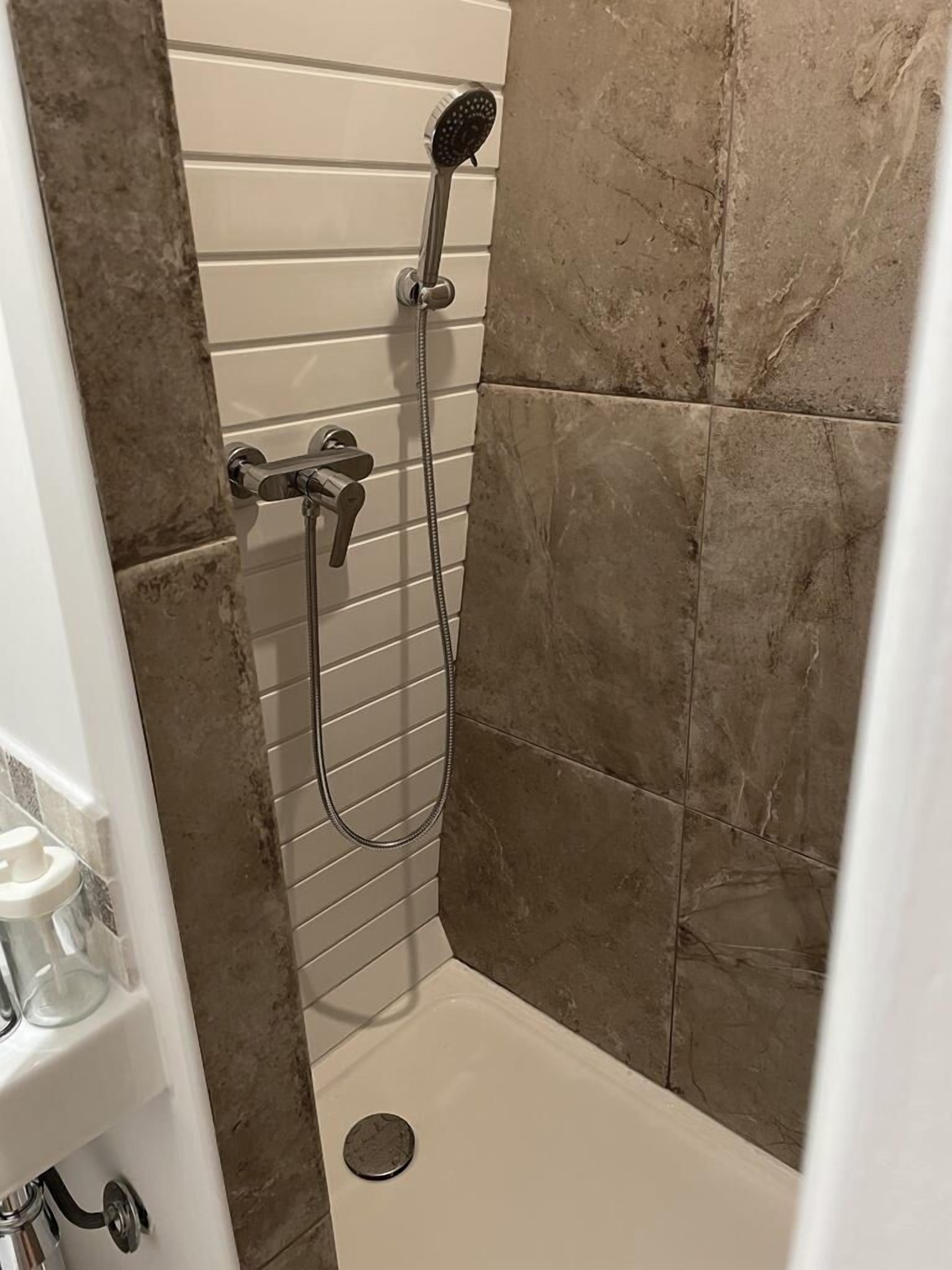 Shower, towels, toilet paper