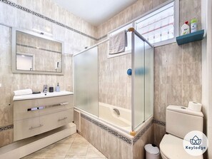 Bathtub, hair dryer, towels