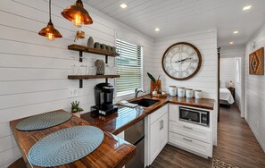 Fridge, microwave, stovetop, coffee/tea maker - Live Oak | Unprecedented Aerial Container Home (Waco)