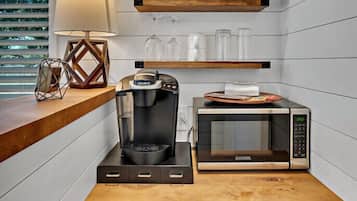 Fridge, microwave, coffee/tea maker, cookware/dishes/utensils