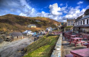 Experience the charm of a traditional coastal village, where picturesque buildings and scenic views come together in harmony.
