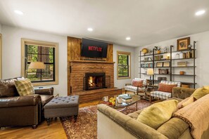 Smart TV, fireplace, books, stereo