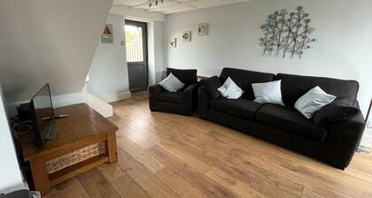 Barn conversion overlooking the golf course to the sea