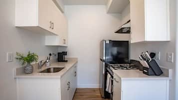Fridge, stovetop, coffee/tea maker, cookware/dishes/utensils