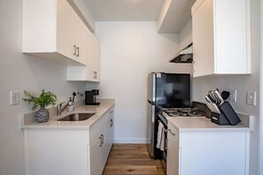 Fridge, stovetop, coffee/tea maker, cookware/dishes/utensils