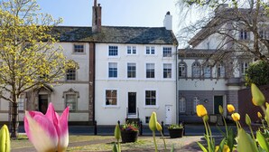A traditional building with a symmetrical facade, multiple windows, and a central entrance. - The Admiral's Home (Whitehaven)