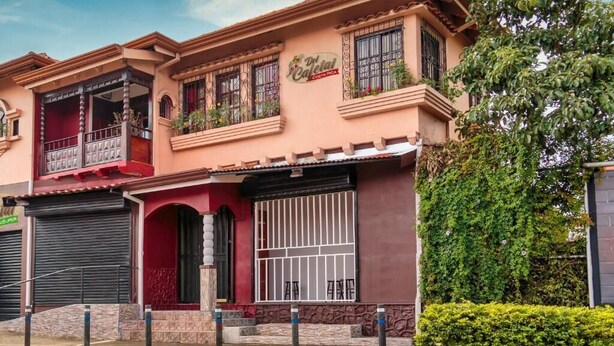 A two-story building with a sign reading "Del Canteen Costa Rica."