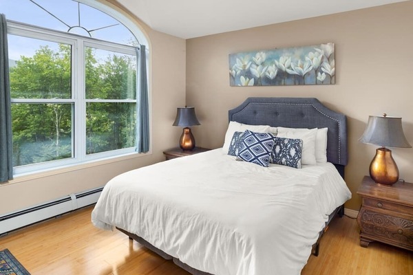 Queen bedroom with shared bathroom.