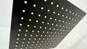 A black triangular showerhead with multiple holes. - Waterfront! Private, Sunrises & Sunsets, Sea life, Deck, 10 minutes to Destin! (Niceville)