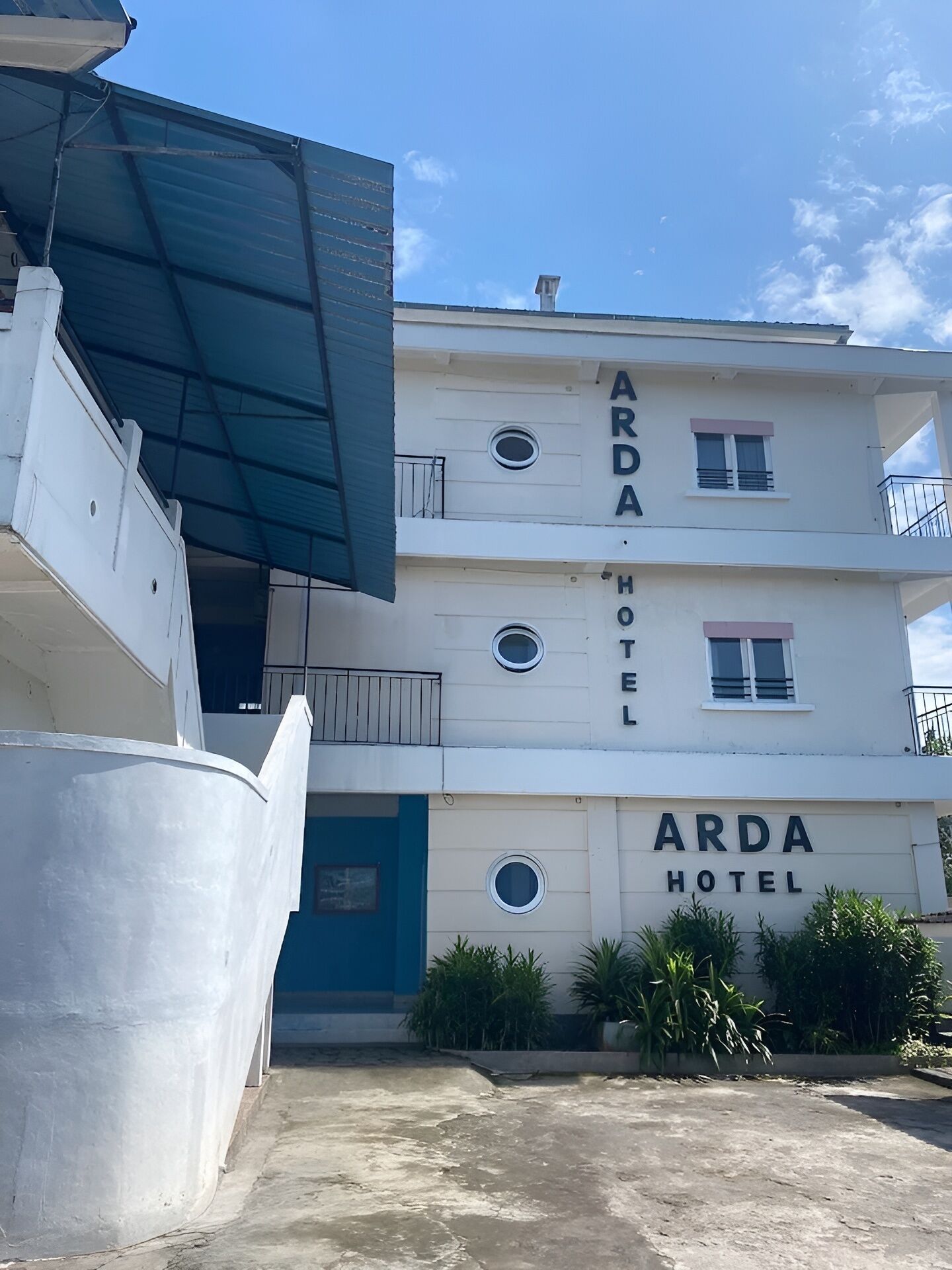 A multi-story building with the name 'Arda Hotel' prominently displayed on the facade.