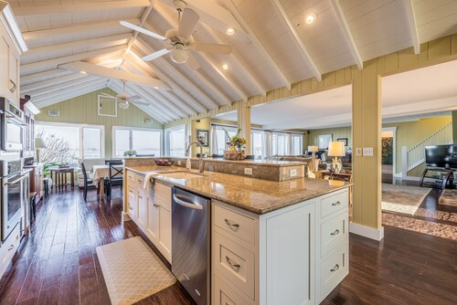 Beautifully updated home on the bay and golf course with dock and raised deck!