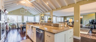 Beautifully updated home on the bay and golf course with dock and raised deck!