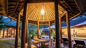 A gazebo with a thatched roof, wooden pillars, and a central light fixture. - 5BR Private Villa near Seminyak (Badung)