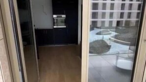 A room with a sliding glass door leading to a balcony. - Luxury 2023 Flat -Center Terrace Parking (Luxembourg City)