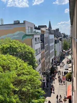 A narrow street lined with multi-story buildings, some with balconies and others with ground-level shops. - 1 bedroom in the Heart of City Center (Luxembourg City)