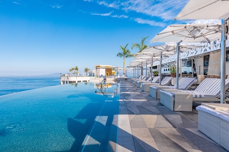 4 outdoor pools, cabanas (surcharge), pool umbrellas