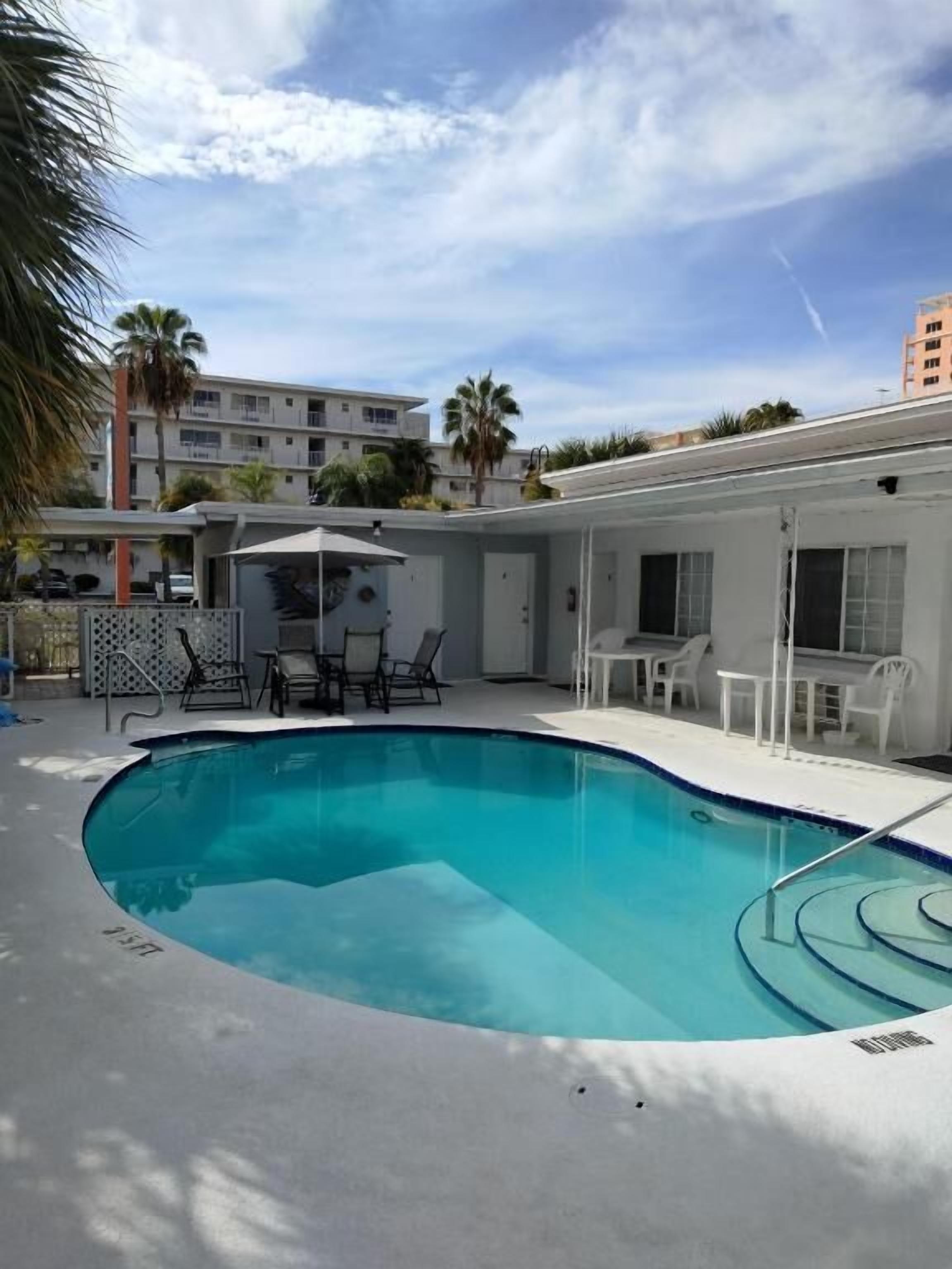 Outdoor pool, open 8:00 AM to 11:00 PM, pool umbrellas, pool loungers