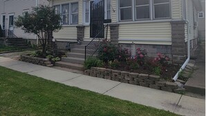 A two-story house with a front porch, a small tree, and a flower bed. - Central to Everything ...Cedar Point, Downtown and Sports Park.   (Sandusky)