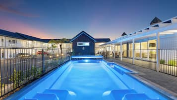 Outdoor pool, open 9:00 AM to 9:00 PM, pool umbrellas, pool loungers