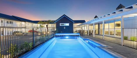 Outdoor pool, open 9:00 AM to 9:00 PM, pool umbrellas, pool loungers