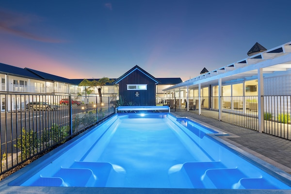 Outdoor pool, open 9:00 AM to 9:00 PM, pool umbrellas, pool loungers
