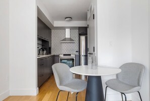 Fridge, microwave, oven, stovetop - Deluxe East Village 2BR w/ Elevator & W/D, nr Union Square, by Blueground (New York)