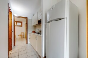 Fridge, stovetop, coffee/tea maker, cookware/dishes/utensils