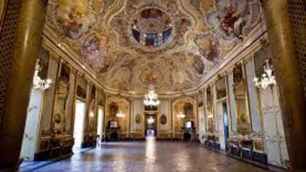 A grand hall with ornate ceiling frescoes, large columns, and chandeliers. - Vicerè Apartment With AC and Wi-Fi, Catania, Italy (Catania)
