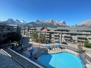 Outdoor pool, a heated pool - Mountain View Condo in Canmore (Canmore)