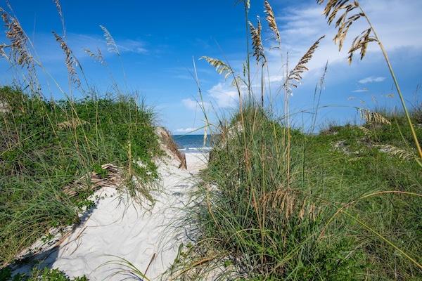 Beach nearby, beach towels, surfing, motor boating