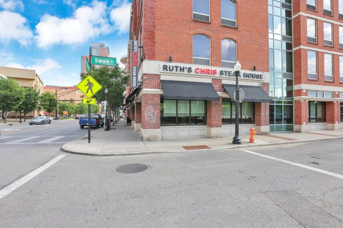 A brick building with a sign for Ruth's Chris Steak House.