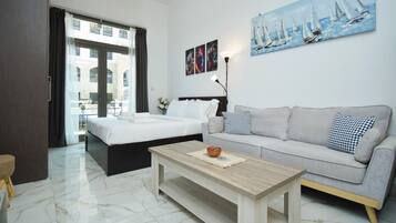 Family Studio, 1 King Bed, Non Smoking, Terrace | Living area | 48-inch flat-screen TV with digital channels, TV