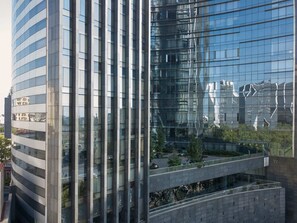 A modern building with reflective glass windows and a curved facade.