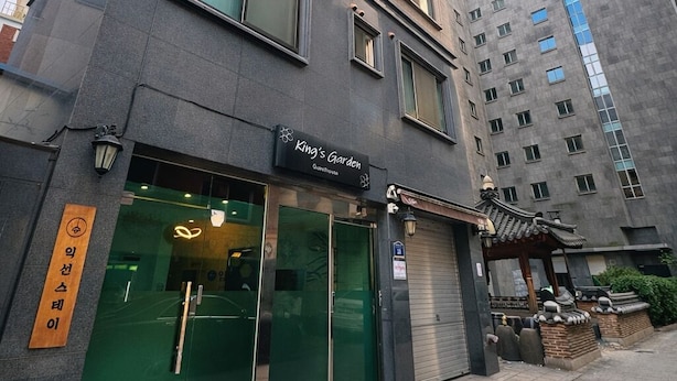 A modern building with a restaurant named 'King's Garden' on the ground floor. - King's garden -Ikseon Stay (Seoul)