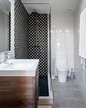 Shower, hair dryer, towels, toilet paper