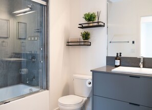 Bathtub, hair dryer, towels