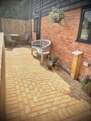 Terrace/patio - The Hayloft offers cosy, modern accommodation in a beautiful rural setting. (Halstead)