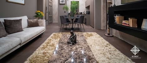 Deluxe Apartment | Living area | 85-inch Smart TV with satellite channels, TV