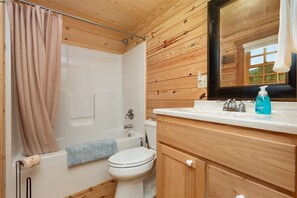 Bathtub, hair dryer, towels