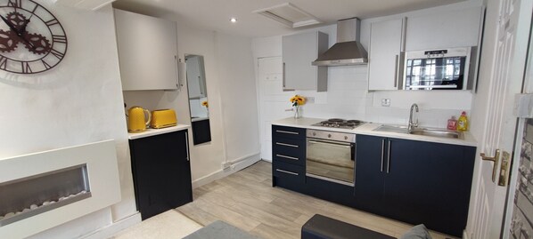 Microwave, toaster, cookware/dishes/utensils