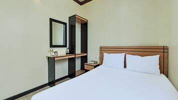 Laptop workspace, bed sheets