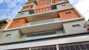 A multi-story residential building with balconies and large windows. - ARZO Hotel Premier (Makati)