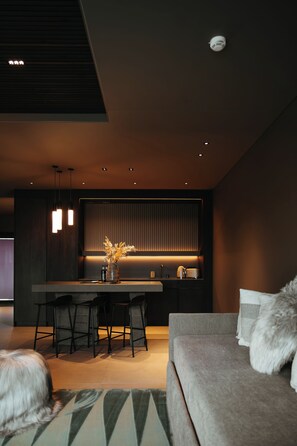 Deluxe Suite | Living area | 55-inch Smart TV with cable channels, TV, heated floors - Signature by Vík Apartments (Vik I Myrdal)