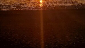 A sunset over a beach with calm waters reflecting the sun. - Heacham 2 bed Superior Caravan With Pets go Free (King's Lynn)