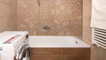 Deluxe Two-Bedroom Apartment with Balcony | Bathroom | Hair dryer, towels, soap, shampoo