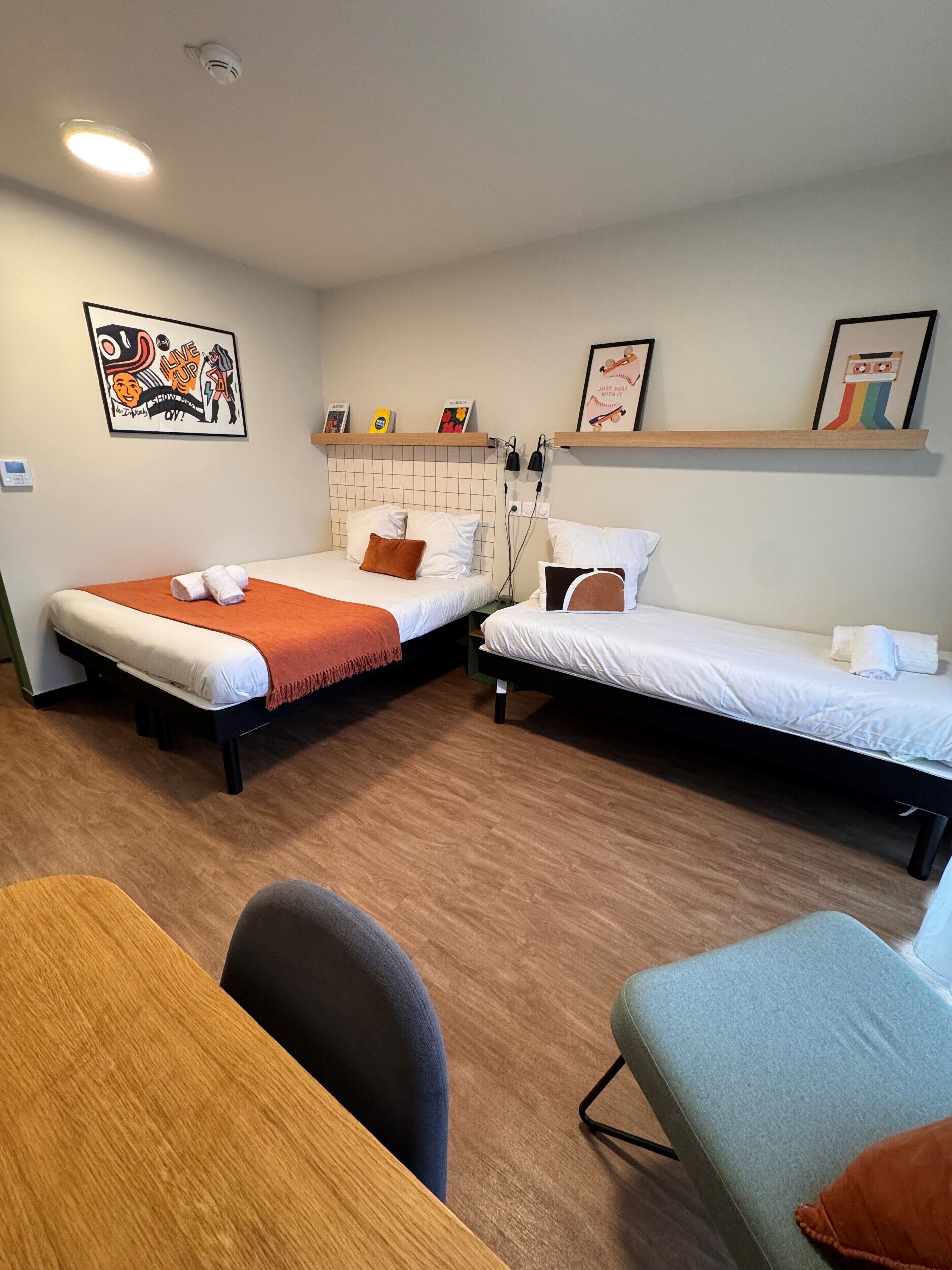 Premium bedding, desk, laptop workspace, soundproofing