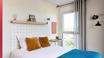 Premium bedding, desk, laptop workspace, soundproofing