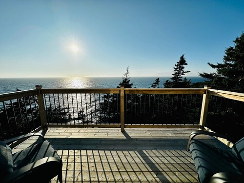 Oceanfront mini home with two decks and spectacular views.
