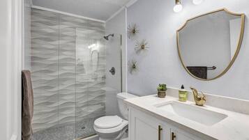 Shower, hair dryer, towels