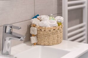 Bathtub, hair dryer, towels